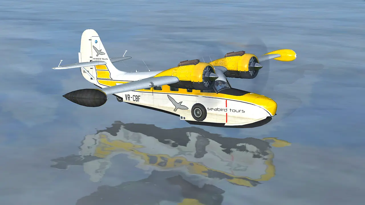 The Grumman Goose amphibian in Flight Simulator X, yellow and white, flying low over gray water