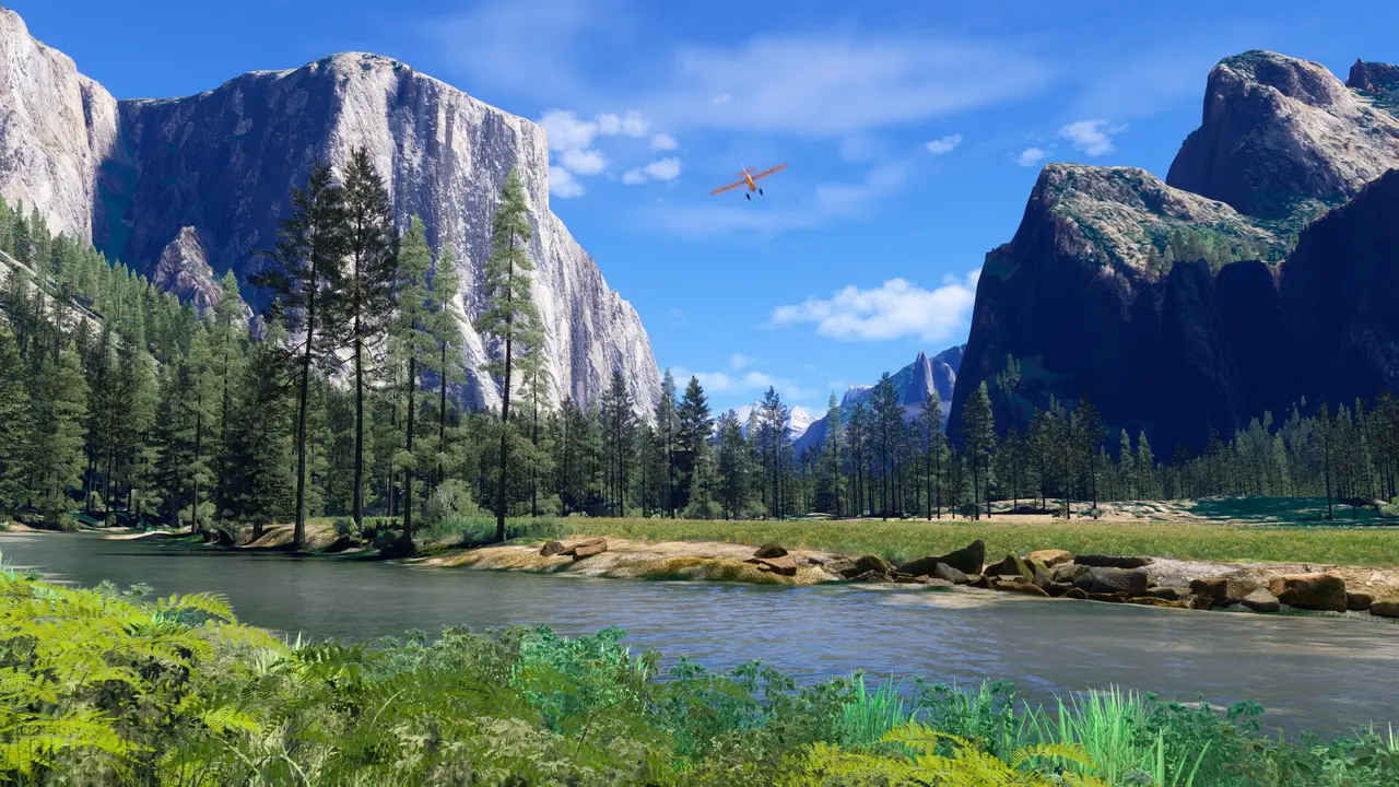 Microsoft Flight Simulator 2024: a small plane flying through Yosemite Valley past granite cliffs, pine forest and a river