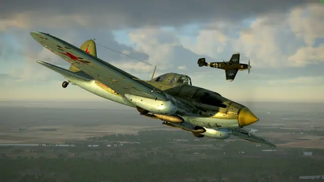 A Soviet Il-2 attack aircraft chased by a German fighter over the countryside in IL-2 Sturmovik